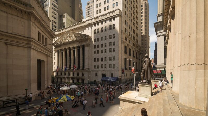 New York Stock Exchange facade at Broad and Wall Street with flag