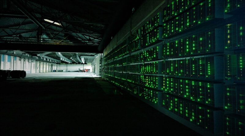 Rows of bitcoin mining machines in a mining farm