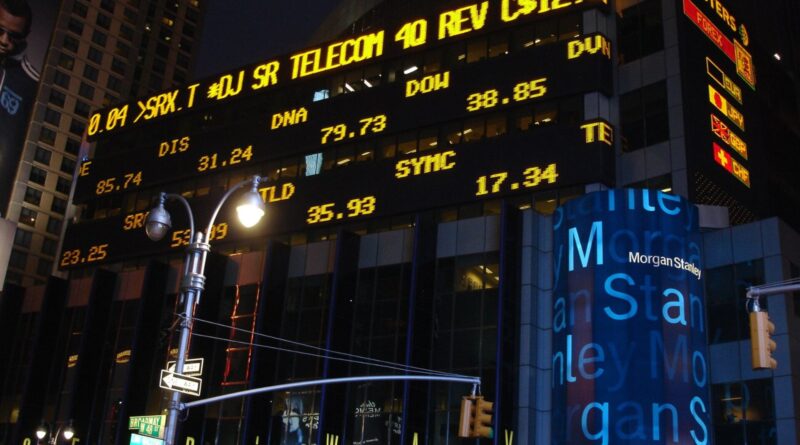Morgan Stanley building in Times Square at night with stock ticker displays