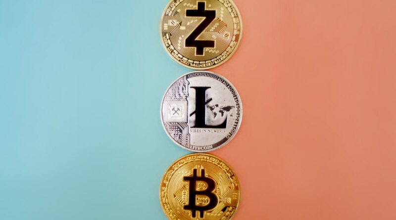 Zcash, Litecoin and Bitcoin coins on a colorful gradient background