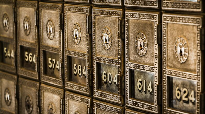 Numbered metal safe deposit boxes in a bank vault